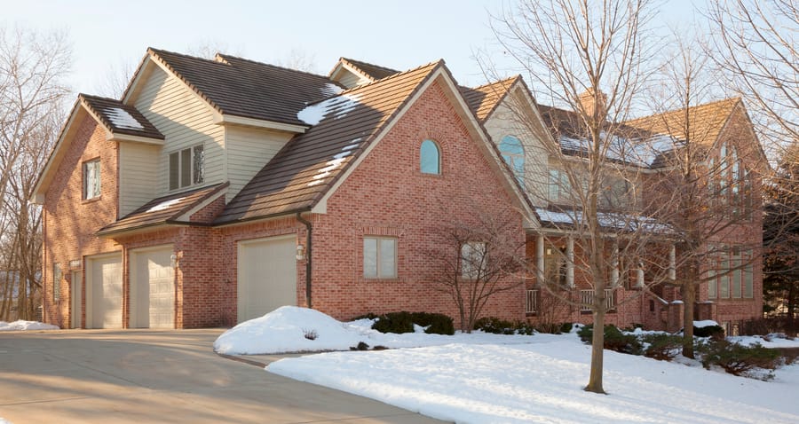 Luxury Denver home with geothermal snow melt system keeping driveway and walkways clear of snow